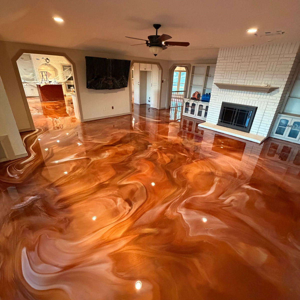 Copper metallic epoxy floor in a residential interior